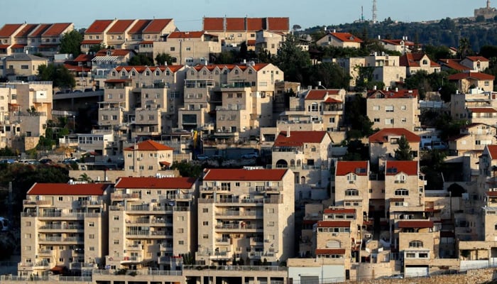 Pohled na židovskou osadu Givat Zeev, mezi Jeruzalémem a Ramalláhem, na Izraelem okupovaném Západním břehu Jordánu, 10. května 2022